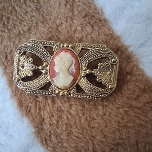 Gold-Tone Cameo Brooch with Coral Accent